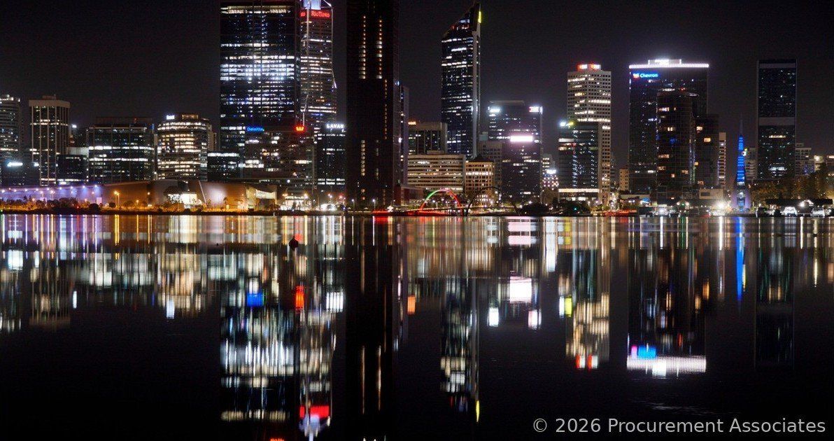 City skyline at night reflected in calm water